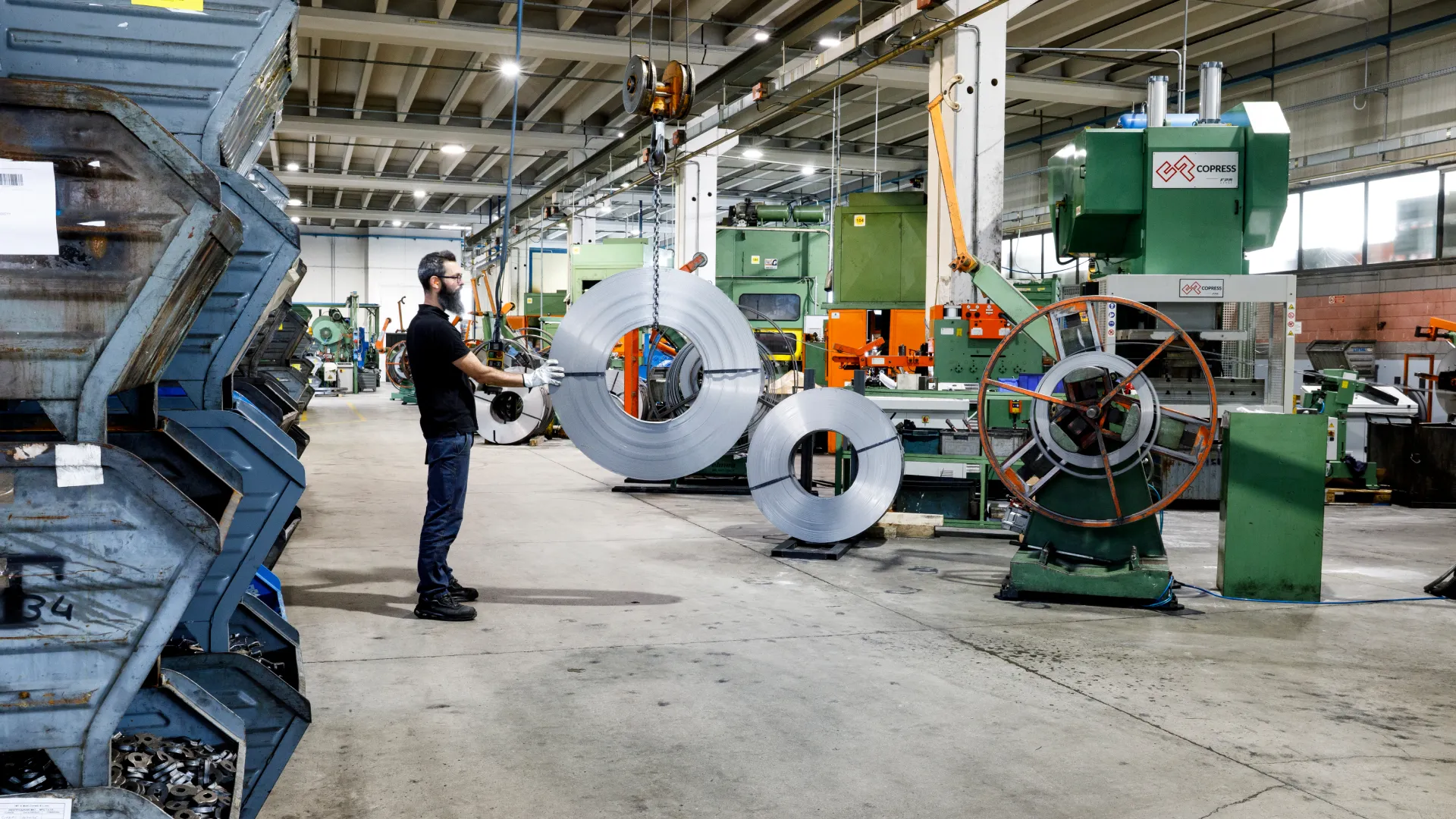 Stamping department of Sifral, a metalworking company, with sheet metal coils and presses