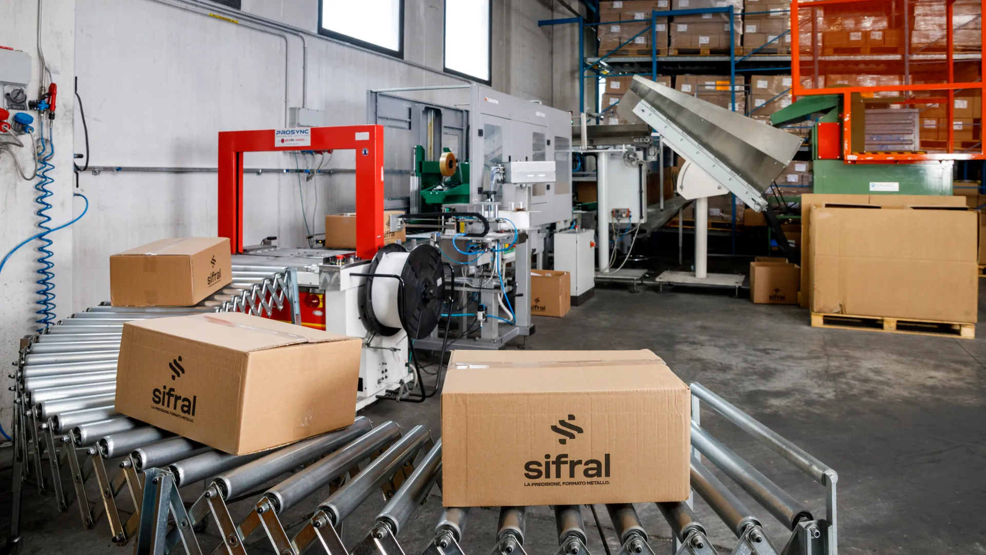 Sheet metal components packed on a roller conveyor and ready for shipping at Sifral